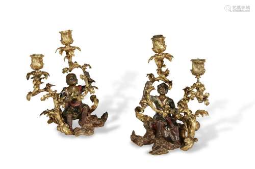 A PAIR OF FRENCH ORMOLU AND LACQUERED-BRONZE TWO-LIGHT CANDE...