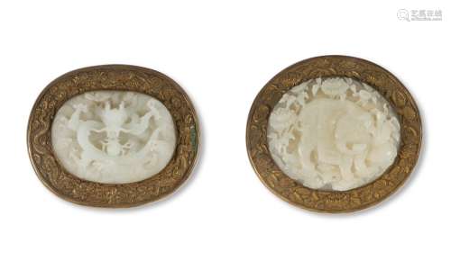 TWO FINELY CARVED CHINESE WHITE JADE PLAQUES IN GILT-METAL M...