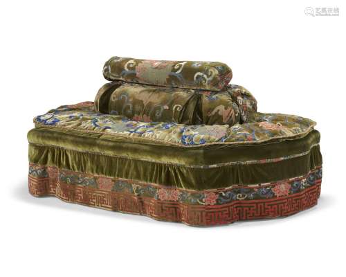 AN OVAL CONFIDANTE UPHOLSTERED IN A CHINESE GREEN-GROUND CUT...