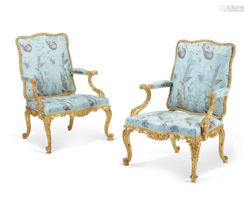 A PAIR OF GEORGE II GILTWOOD ARMCHAIRS