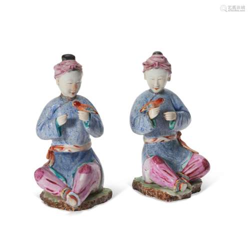 A PAIR OF CHINESE EXPORT PORCELAIN FAMILLE ROSE FIGURES OF S...