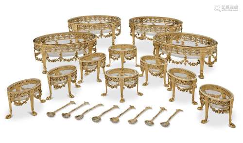 A SUITE OF FOUR VICTORIAN SILVER-GILT SWEETMEAT DISHES AND E...