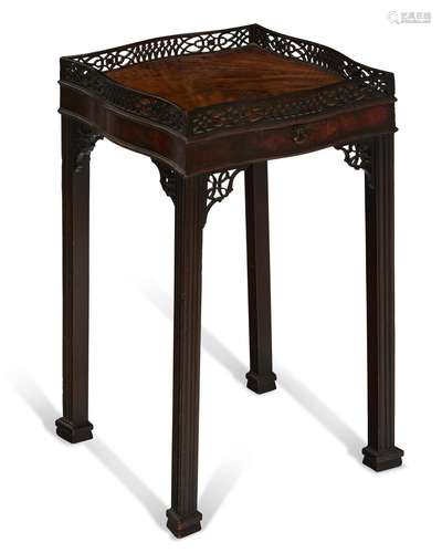 AN EARLY GEORGE III MAHOGANY URN STAND