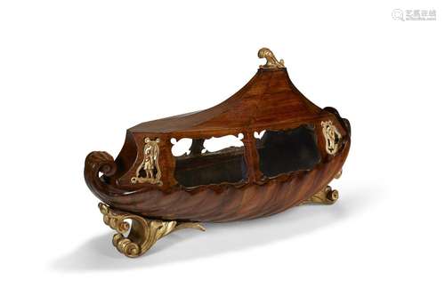 AN ITALIAN PARCEL-GILT WALNUT BOAT-FORM CASKET