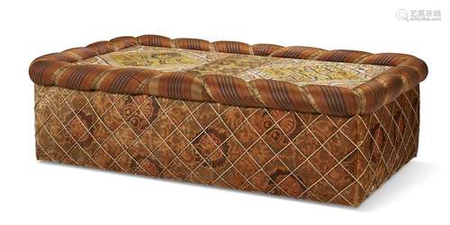 AN UPHOLSTERED OTTOMAN INCORPORATING KAITAG EMBROIDERY