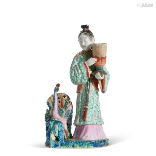 A CHINESE EXPORT PORCELAIN FAMILLE ROSE CANDLESTICK FIGURE G...