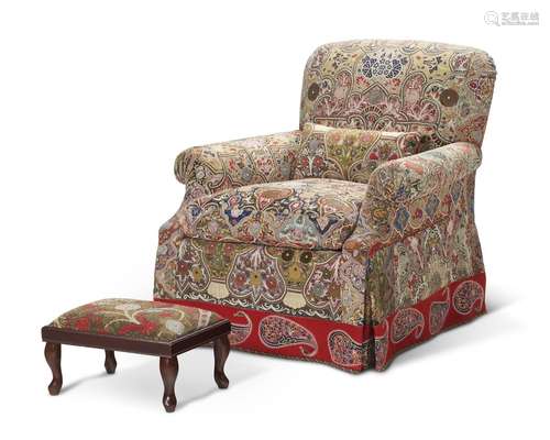 AN UPHOLSTERED CLUB CHAIR COVERED IN RESCHT EMBROIDERY