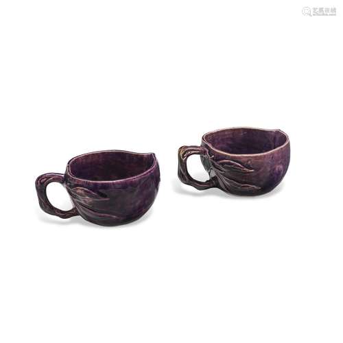 A PAIR OF CHINESE AUBERGINE-GLAZED PEACH-FORM LIBATION CUPS