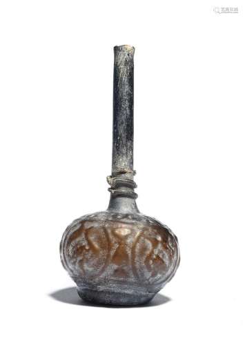 【R】A mould blown glass bottle Persia, late 11th-13th Century