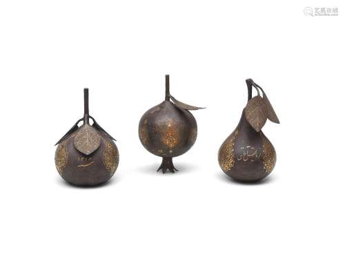 【*】Three Qajar gold damascened steel fruits presented by Rez...