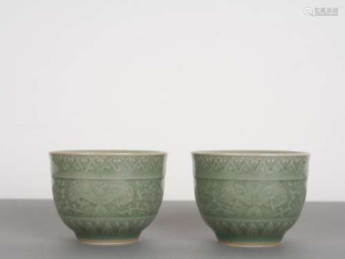 Chinese Pair of Antique Celadon Moulded Bowls