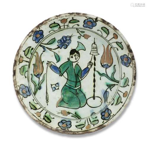 A FIGURAL IZNIK POTTERY DISH OTTOMAN TURKEY, FIRST HALF 17TH...