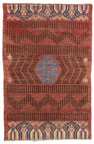 AN 'RKO' MEDALLION KHOTAN RUG EAST TURKESTAN, CIRCA 1800