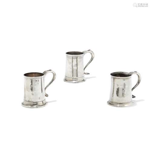 Three silver mugs