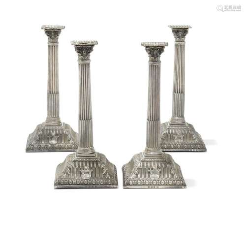 Group of four silver candlesticks