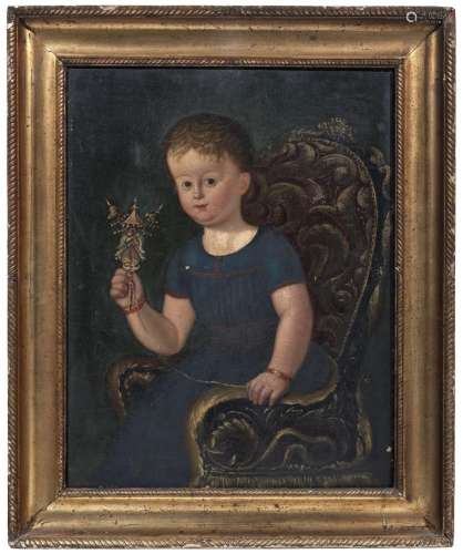 Portrait of a little girl playing with a Chinese doll