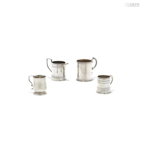 Group of four small silver mugs