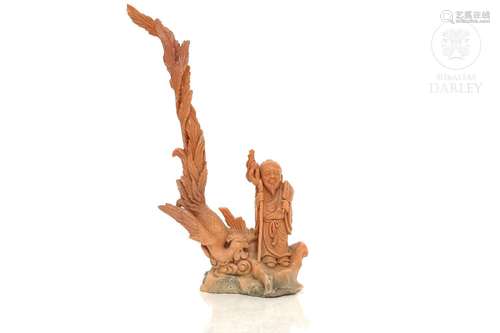 Chinese carved coral "Sage with phoenix", 20th Cen...