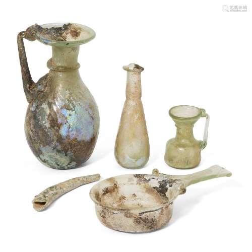 Four Roman glass vessels, circa 2nd-4th Century A.D.<br />
<...