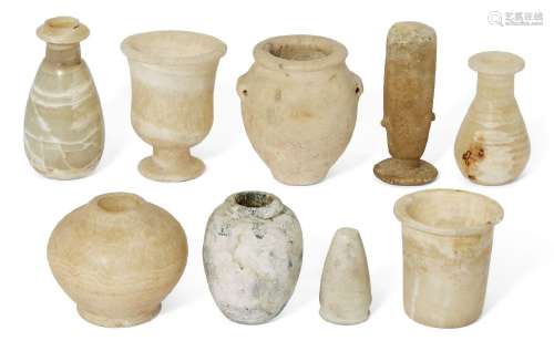A group of Antiquities comprising four small Egyptian alabas...
