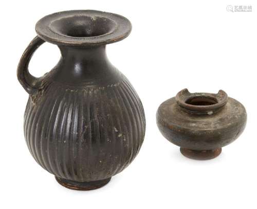 Two black glazed pottery vessels<br />
Possibly Greek circa ...