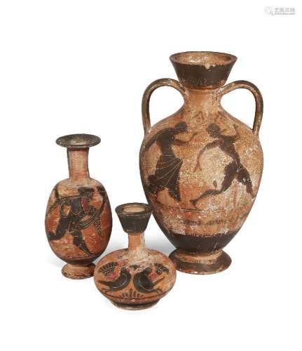 Three Greek style pottery vessels, including an amphora with...