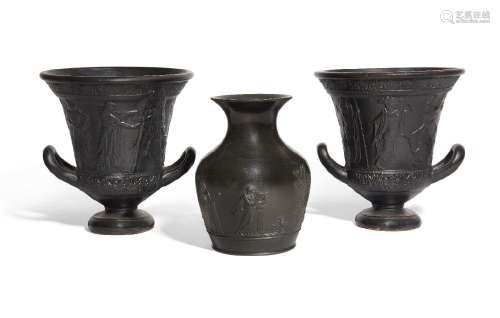 Three decorative black glazed vessels, including two kraters...