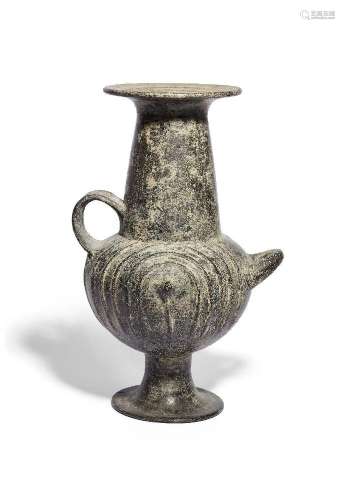 A Villanovan impasto ware urn, 8th Century B.C., the bulbous...