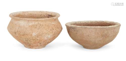 A Bronze Age buff terracotta bowl with carinated sides and o...