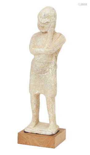 A hollow terracotta standing theatrical figure wearing the m...