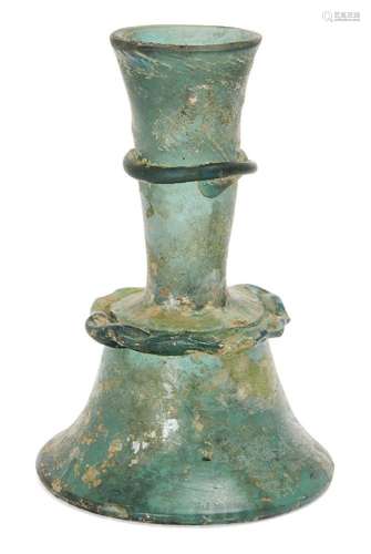 A green glass candlestick, Iran, 15th century, 14.8cm. highP...