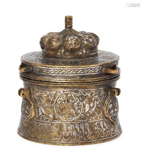 A large silver inlaid brass inkwell with animated inscriptio...