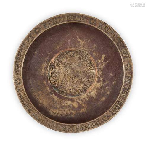 A engraved Khorasan copper inlaid bronze dish, of deep form,...