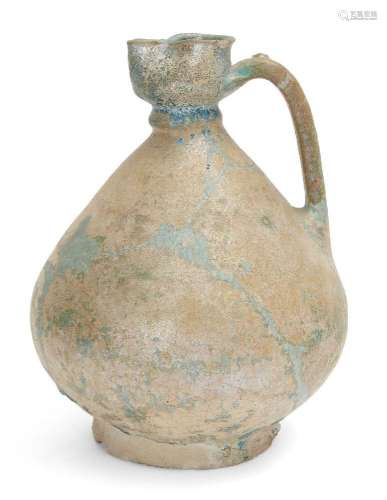 A Kashan turquoise-glazed pottery ewer, Iran, 12th century, ...