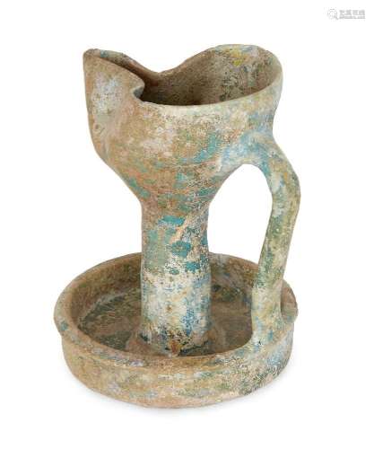 A turqoise glazed pottery oil lamp, Kashan, Persia, 12th cen...