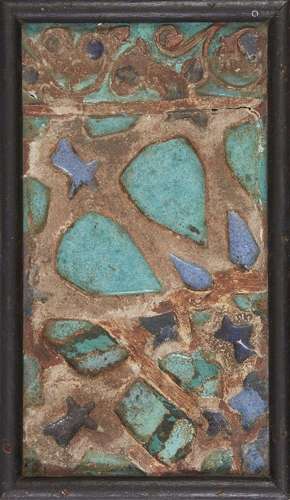 A turquoise and cobalt glazed cuerda seca pottery tile fragm...