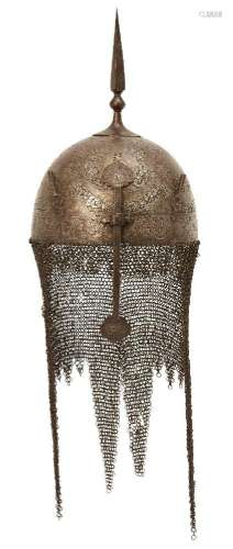 A Qajar gold damascened steel helmet and shield,<br />
Persi...