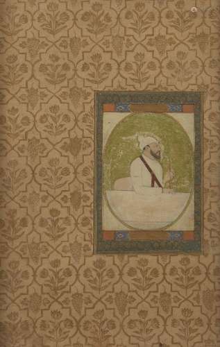A Mughal portrait of a nobleman smoking, India, 17th century...