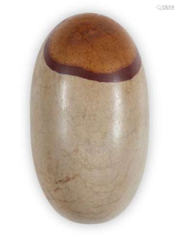 A small polished lingham stone, India, with dark brownish ci...
