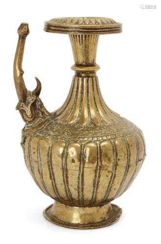 A moulded brass ewer, North India, 15th-16th century, on a r...