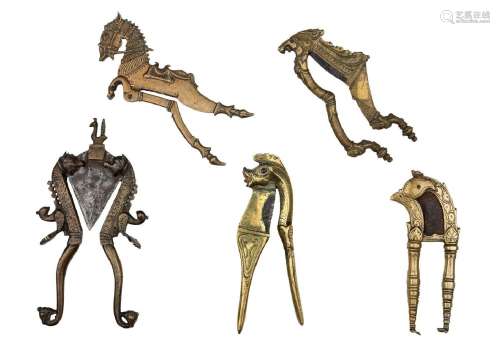 A group of five brass and steel zoomorphic betel nut cutters...