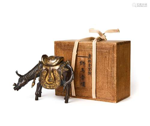 A HIGHLY RARE CHINESE GILT BRONZE DONKEY FIGURE, MING DYNAST...