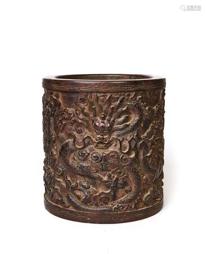 A CHINESE CARVED WOOD DRAGON BRUSH POT, PROBABLY ZITAN WOOD,...