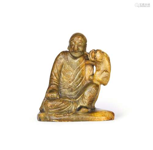 A CHINESE CARVED SOAPSTONE FIGURE OF A SEATED LUOHAN, 18TH C...