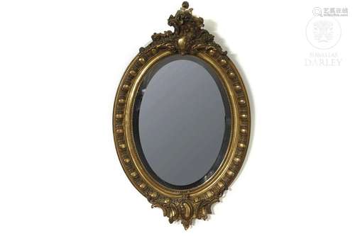 Carved and gilded wooden mirror, 20th century