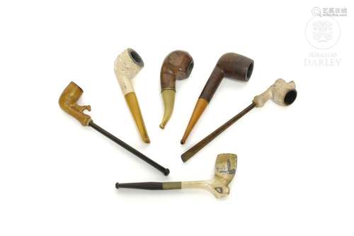 Lot of six pipes made of various materials, early 20th centu...