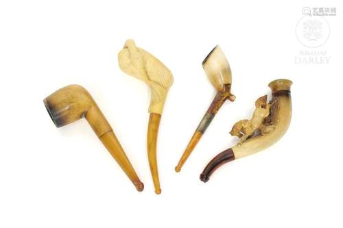 Four seafoam and amber pipes, early 20th century