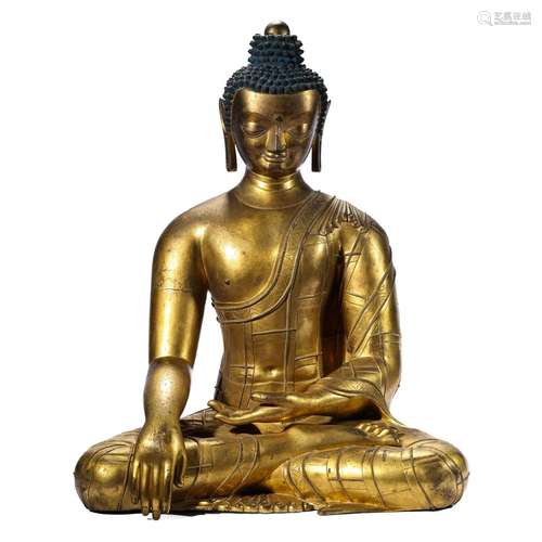 A GILT-BRONZE FIGURE OF SHAKYAMUNI