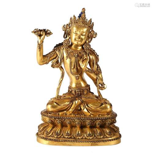 A GILT-BRONZE BODHISATTVA HOLDING A VAJRA