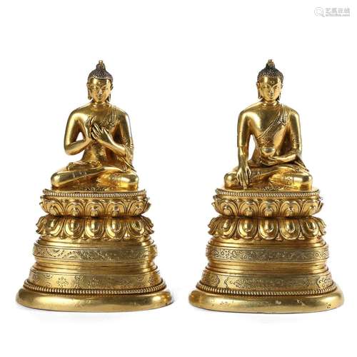 A PAIR OF GILT-SILVER FIGURES OF SHAKYAMUNI